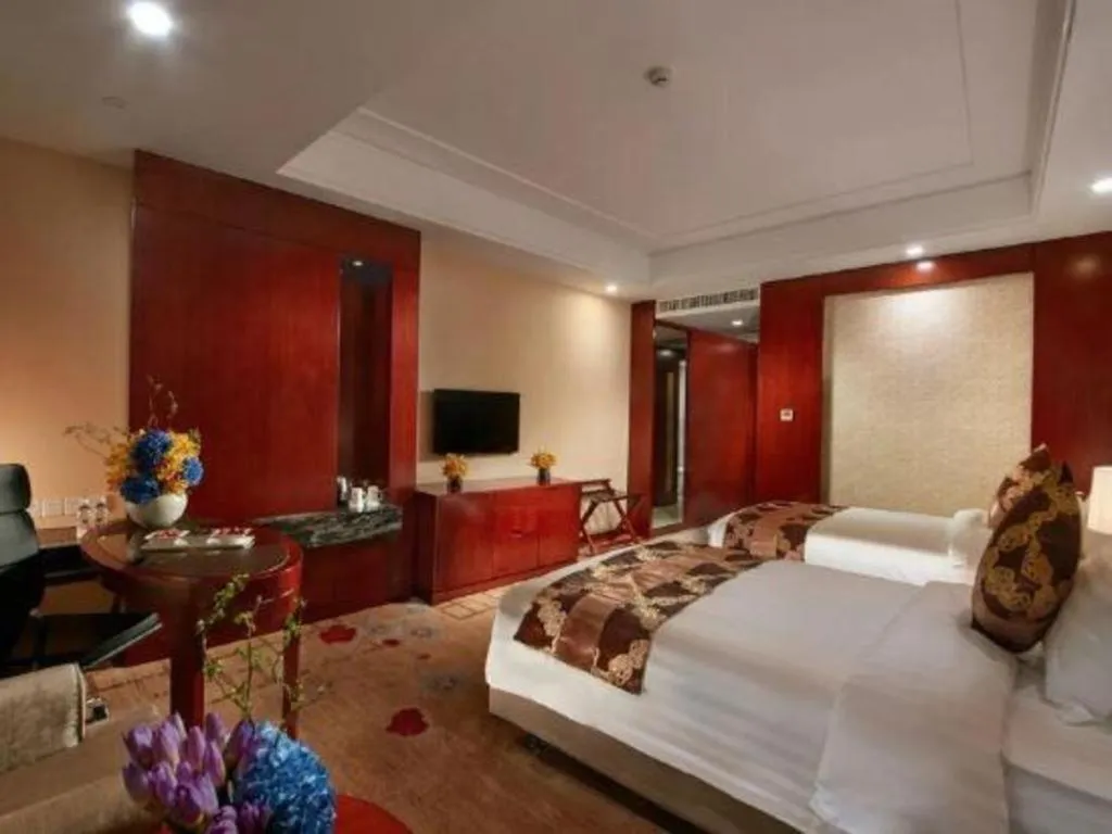 Bed in New Century Hotel Putuo Zhoushan