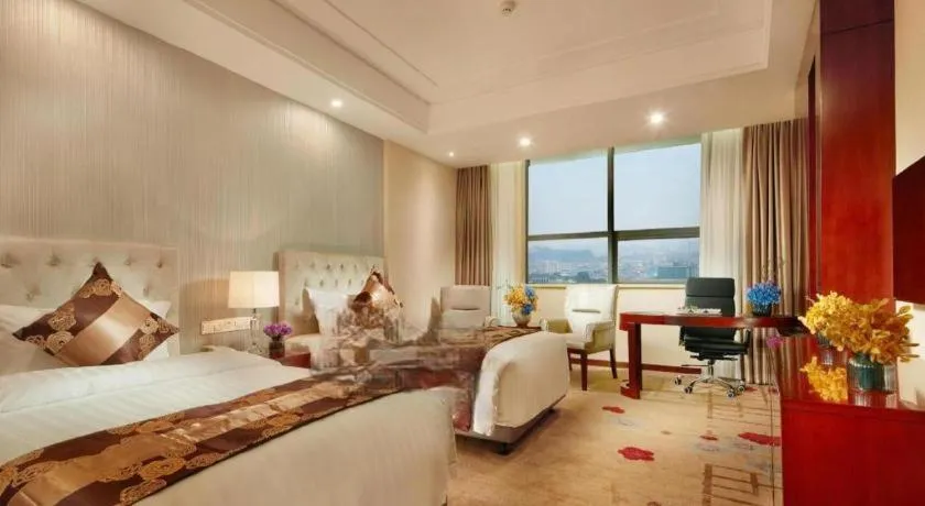 Bed in New Century Hotel Putuo Zhoushan