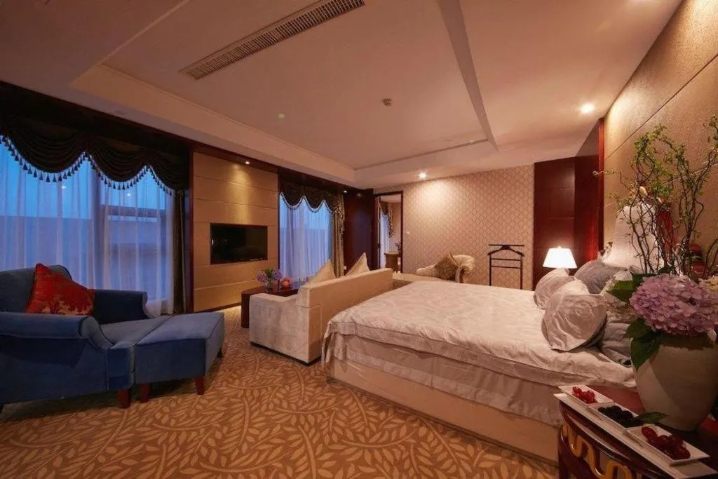 Bed in New Century Hotel Putuo Zhoushan