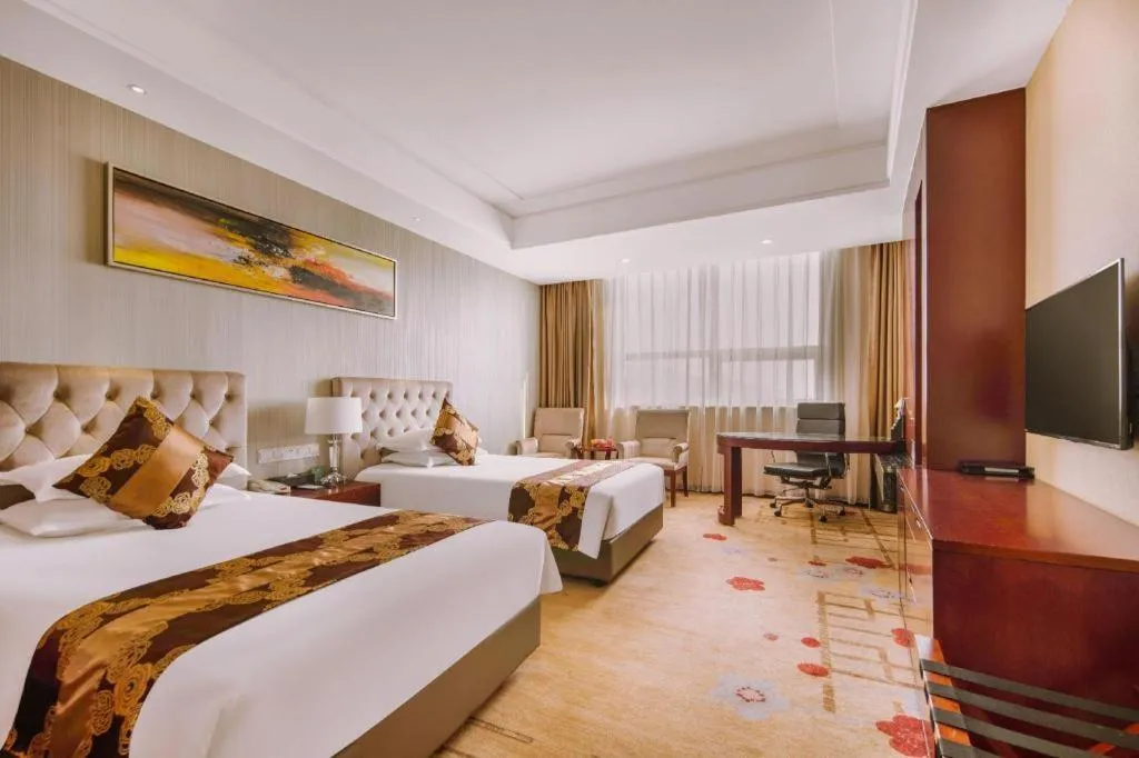 Bed in New Century Hotel Putuo Zhoushan