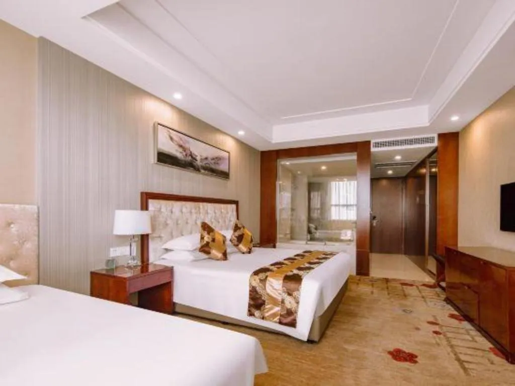 Bed in New Century Hotel Putuo Zhoushan