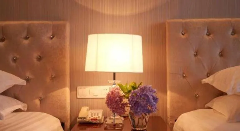 Bed in New Century Hotel Putuo Zhoushan