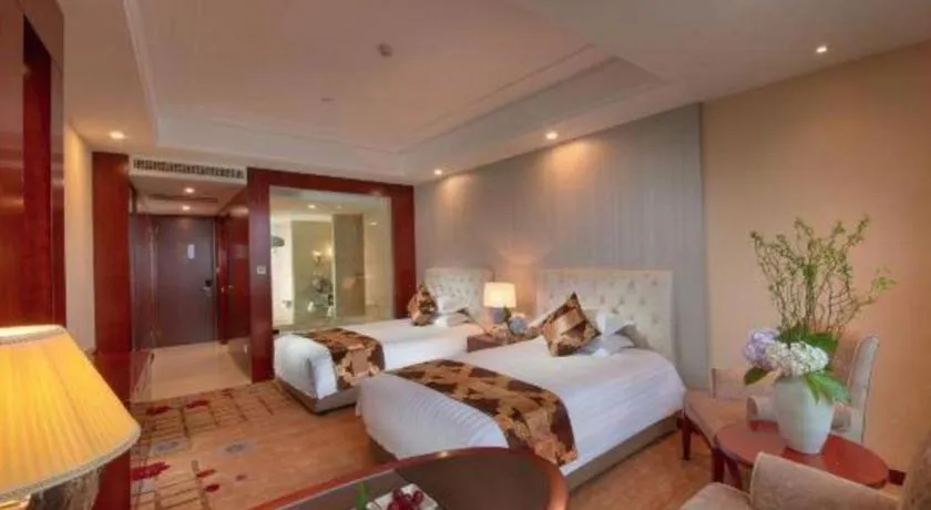Bed in New Century Hotel Putuo Zhoushan