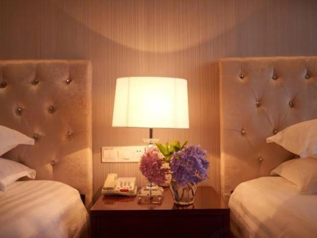 Bed in New Century Hotel Putuo Zhoushan