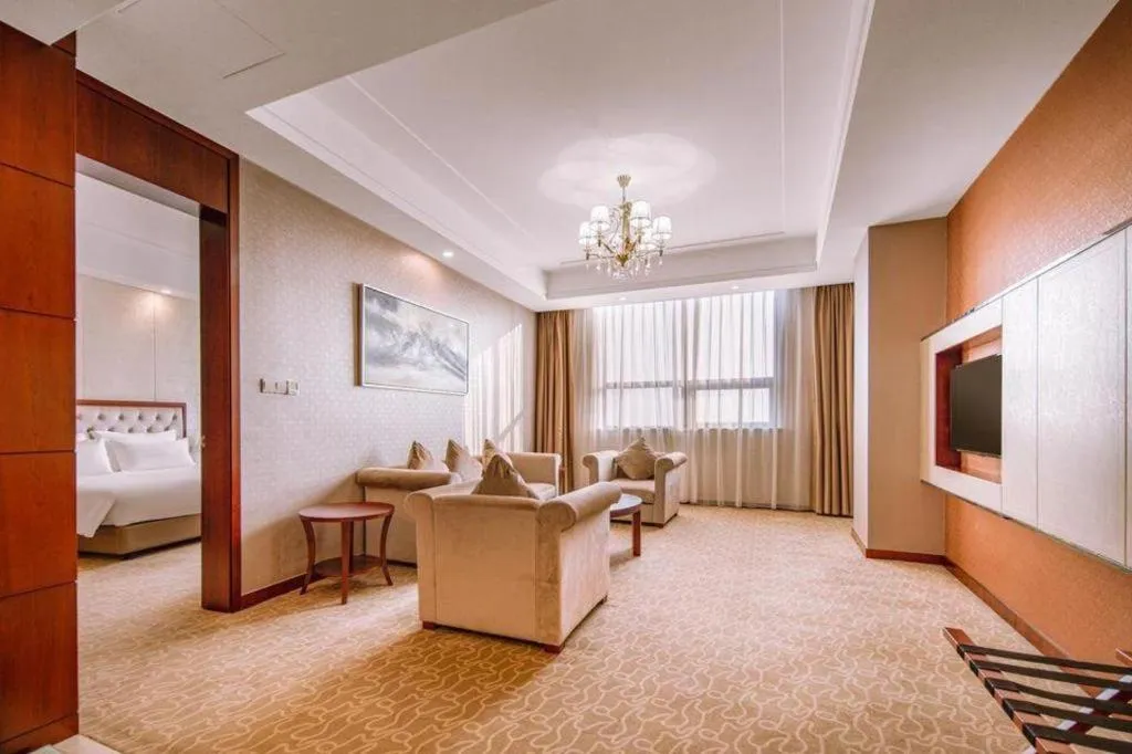 Bed in New Century Hotel Putuo Zhoushan