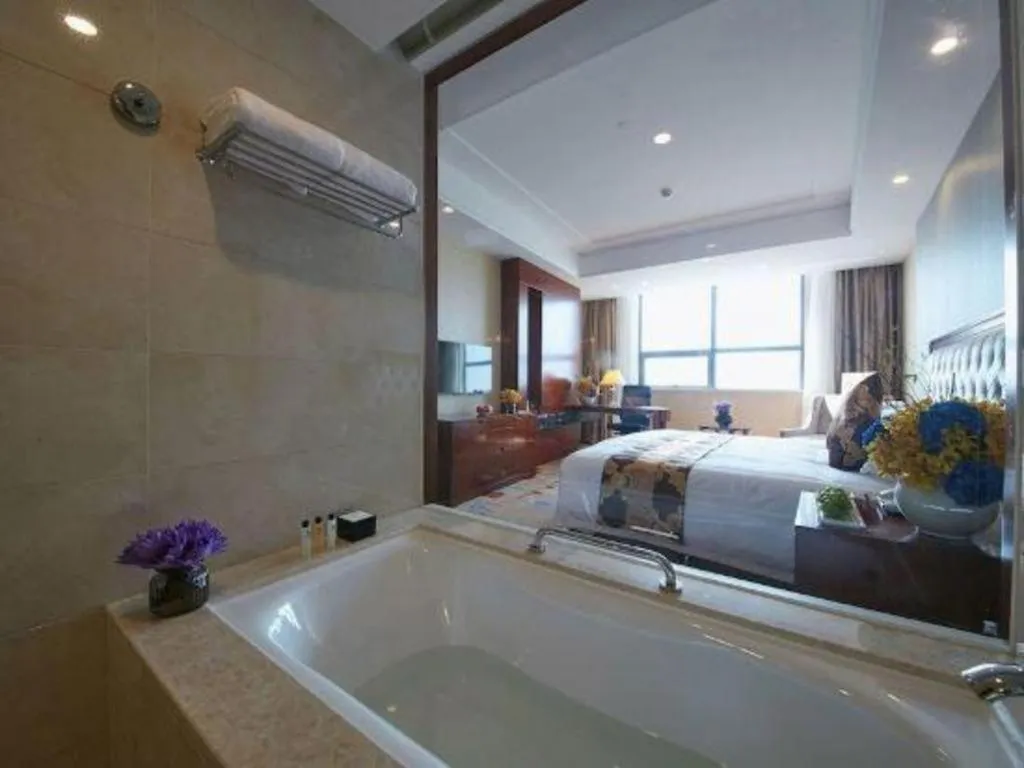 Bed in New Century Hotel Putuo Zhoushan