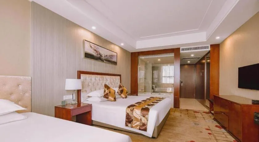 Bed in New Century Hotel Putuo Zhoushan