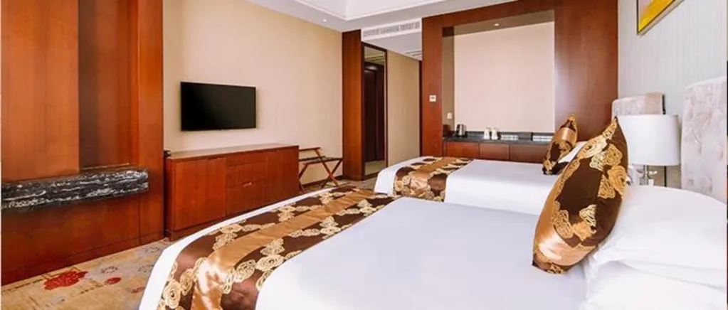 Bed in New Century Hotel Putuo Zhoushan