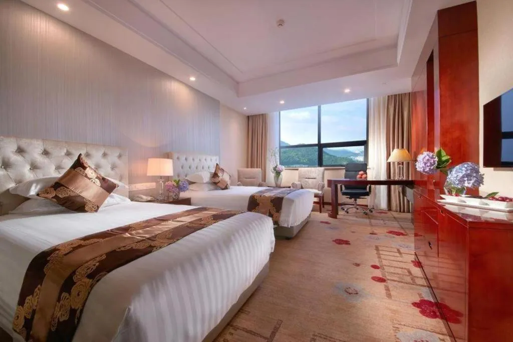 Bed in New Century Hotel Putuo Zhoushan
