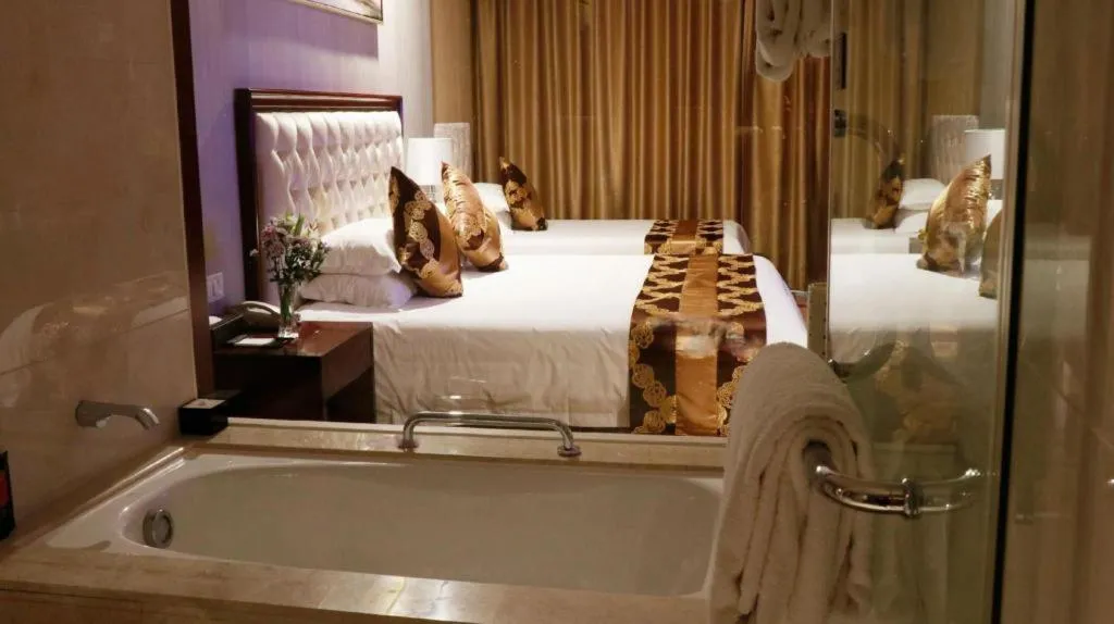 Bed in New Century Hotel Putuo Zhoushan