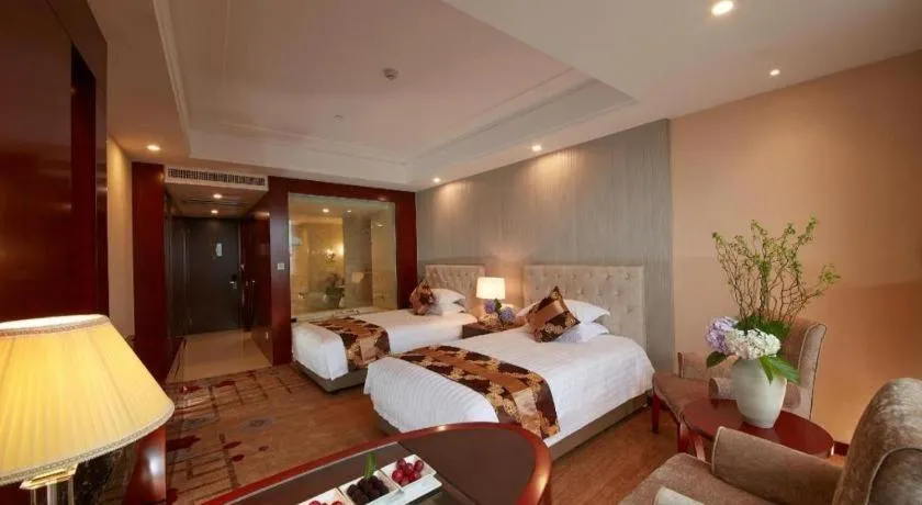 Bed in New Century Hotel Putuo Zhoushan