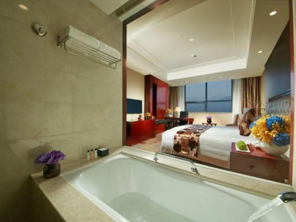 Bed in New Century Hotel Putuo Zhoushan