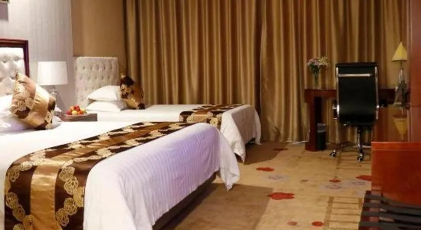 Bed in New Century Hotel Putuo Zhoushan