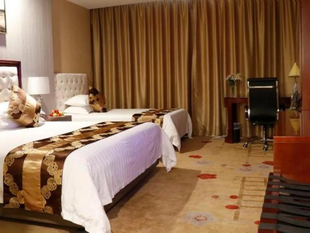 Bed in New Century Hotel Putuo Zhoushan