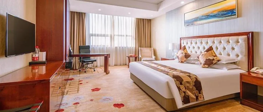 Bed in New Century Hotel Putuo Zhoushan