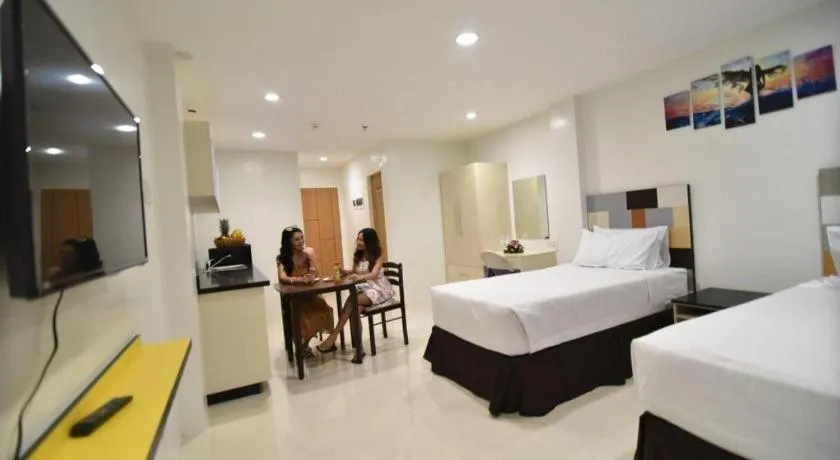 Bed in Holiday Oceanview Residences and Resort