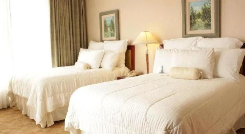 Bed in Hotel Honduras Maya