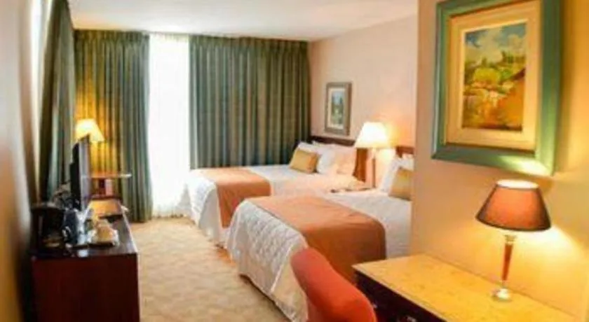 Bed in Hotel Honduras Maya