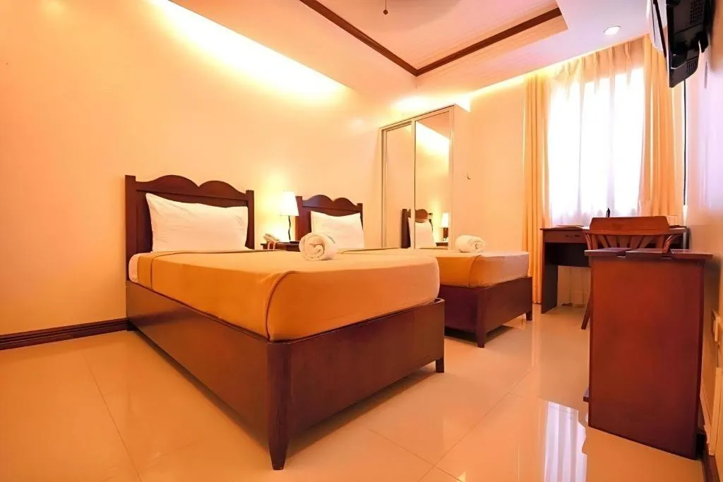 Bed in Ipil Suites Puerto Princesa