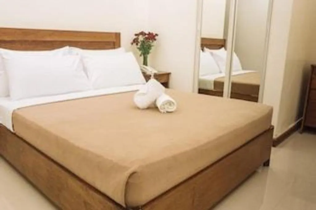Bed in Ipil Suites Puerto Princesa