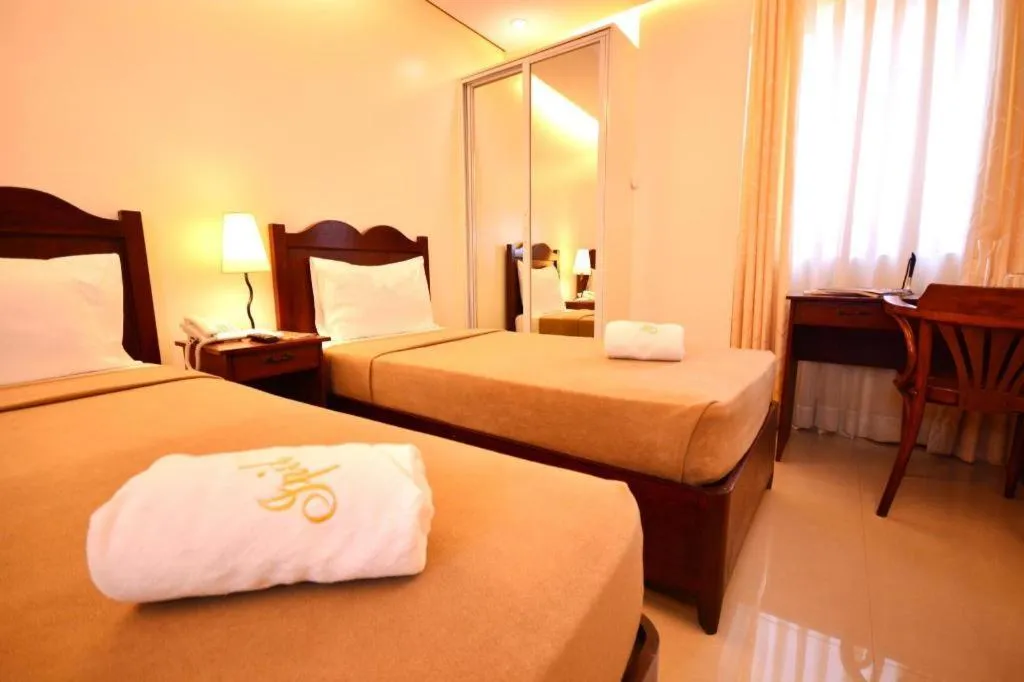 Bed in Ipil Suites Puerto Princesa