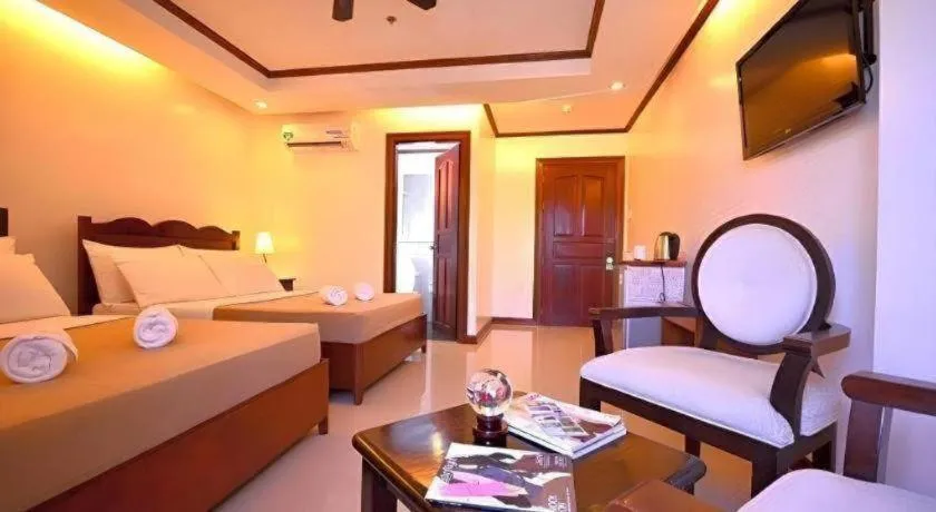 Bed in Ipil Suites Puerto Princesa