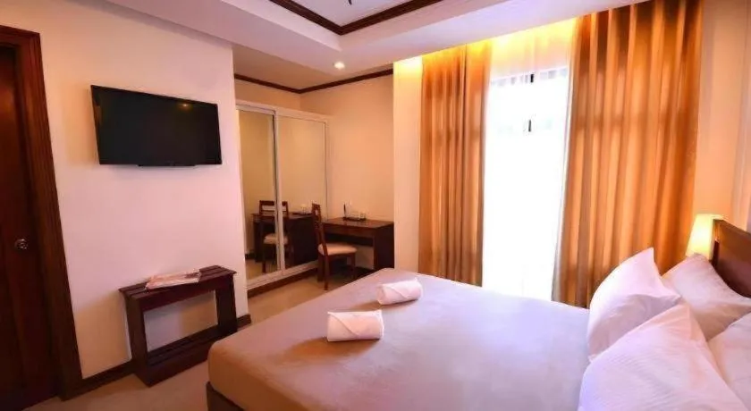 Bed in Ipil Suites Puerto Princesa