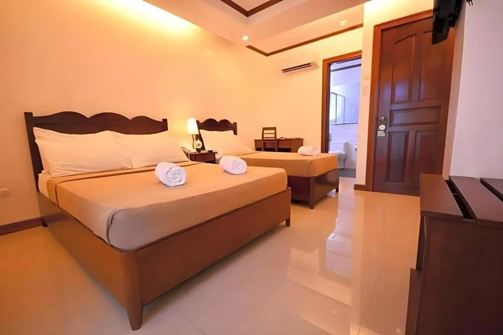 Bed in Ipil Suites Puerto Princesa