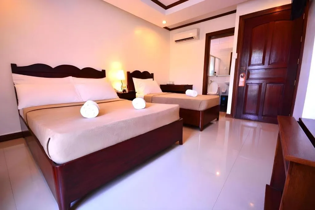 Bed in Ipil Suites Puerto Princesa