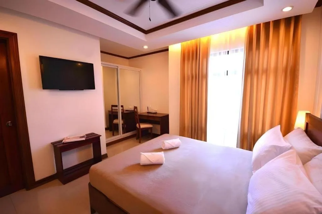 Bed in Ipil Suites Puerto Princesa