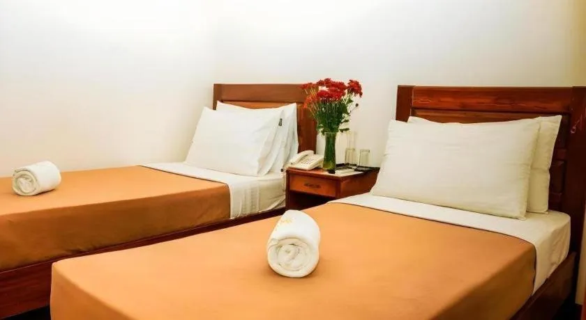 Bed in Ipil Suites Puerto Princesa