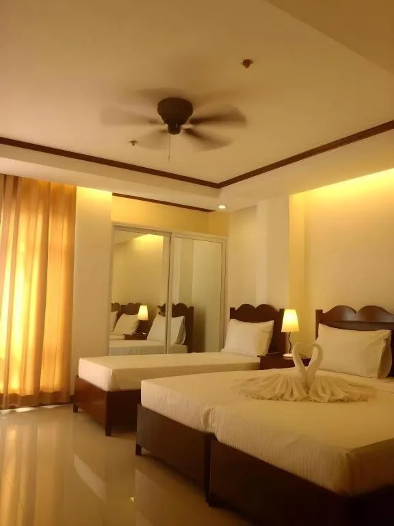 Bed in Ipil Suites Puerto Princesa