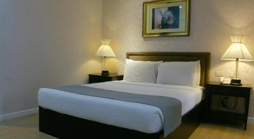 Bed in Queen Margarette Hotel
