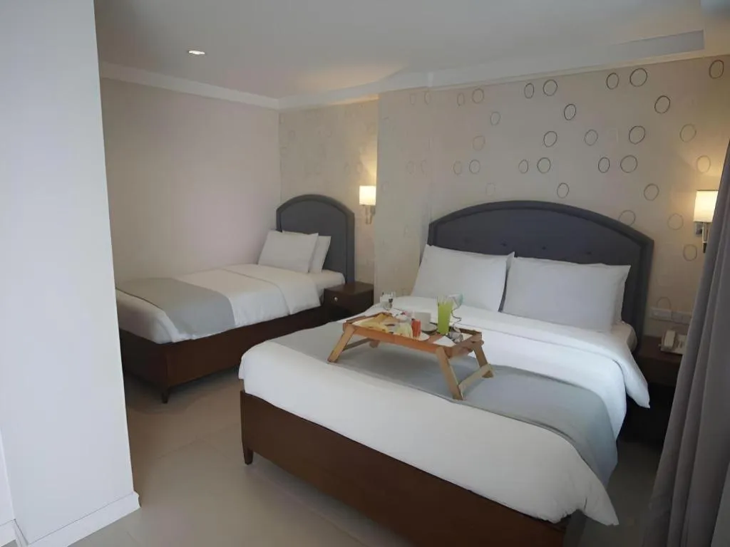 Bed in Queen Margarette Hotel