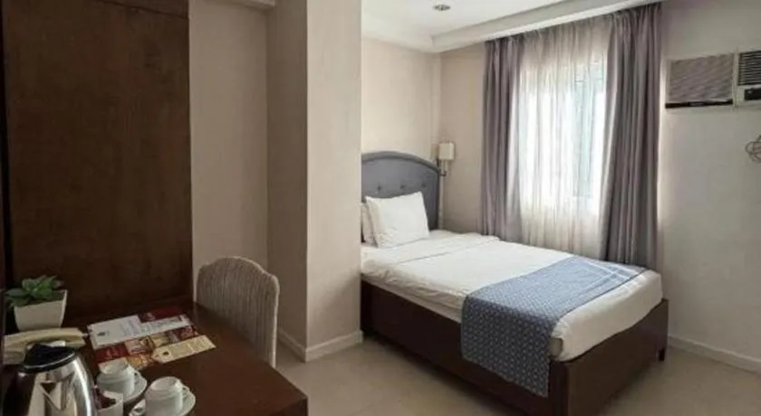 Bed in Queen Margarette Hotel