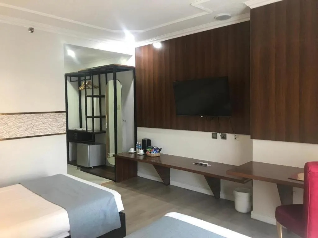 Bed in Queen Margarette Hotel