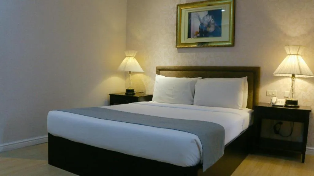 Bed in Queen Margarette Hotel