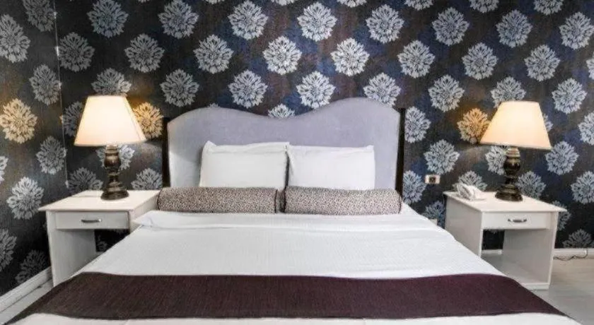 Bed in Queen Margarette Hotel