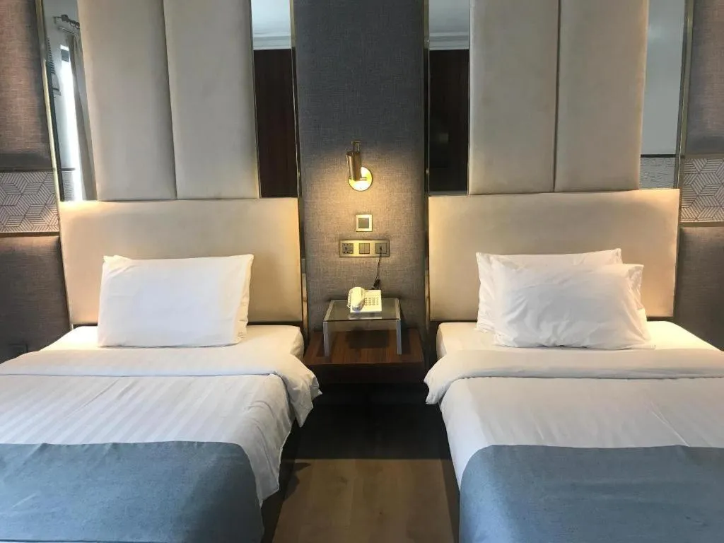 Bed in Queen Margarette Hotel