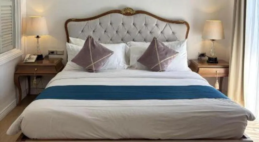 Bed in Queen Margarette Hotel