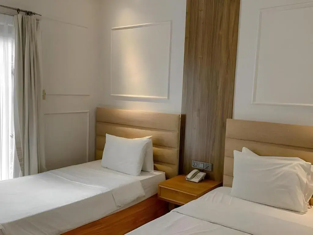 Bed in Queen Margarette Hotel Bed in Queen Margarette Hotel