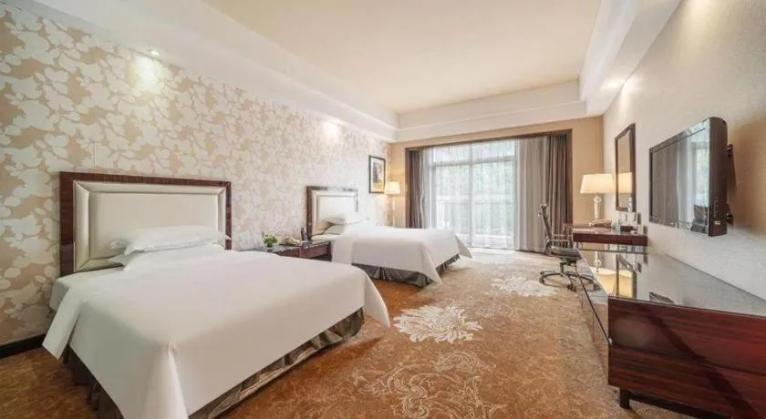 Bed in Country Garden Phoenix Hotel Yunfu