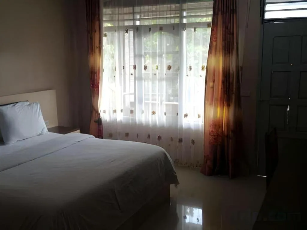 Bed in Samosir Cottages Resort