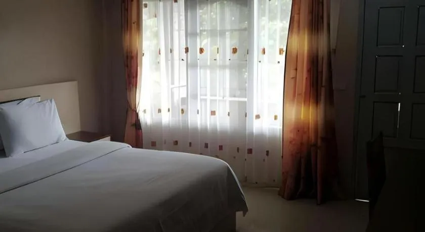 Bed in Samosir Cottages Resort