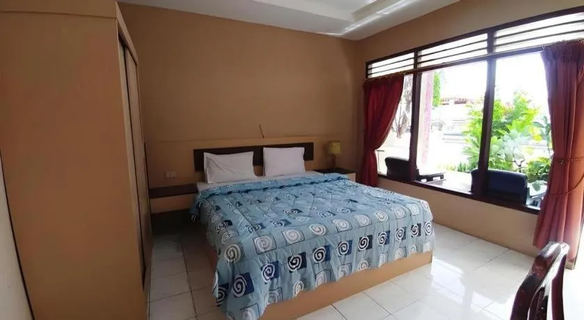 Bed in Samosir Cottages Resort