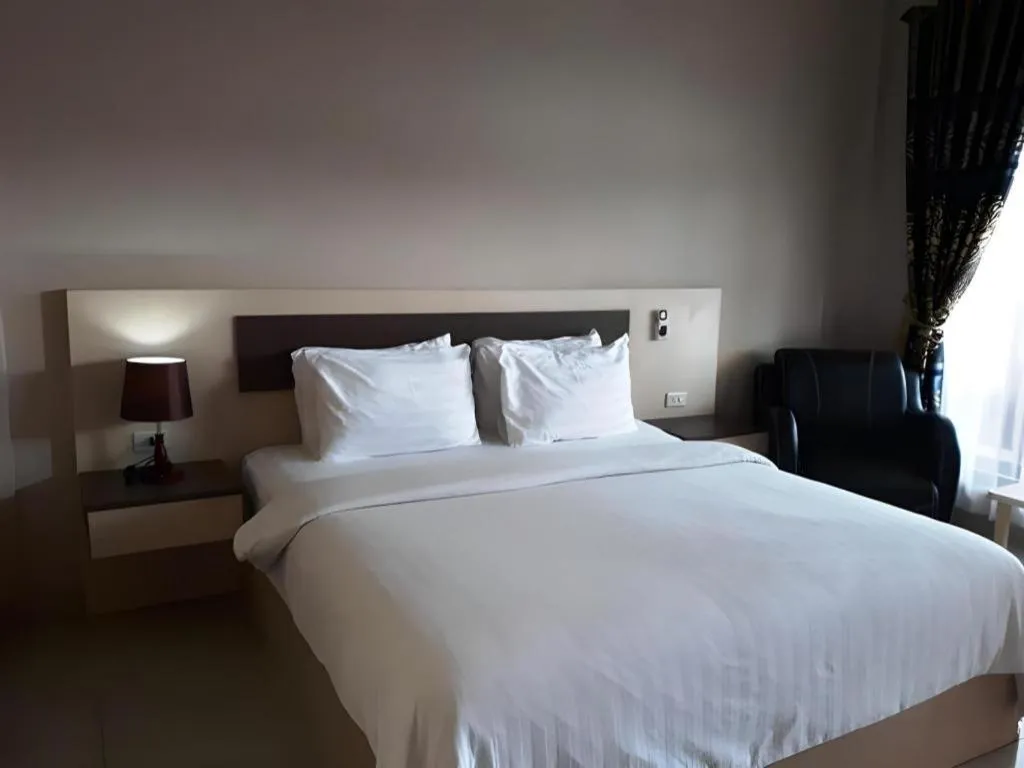 Bed in Samosir Cottages Resort