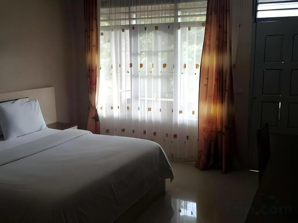 Bed in Samosir Cottages Resort
