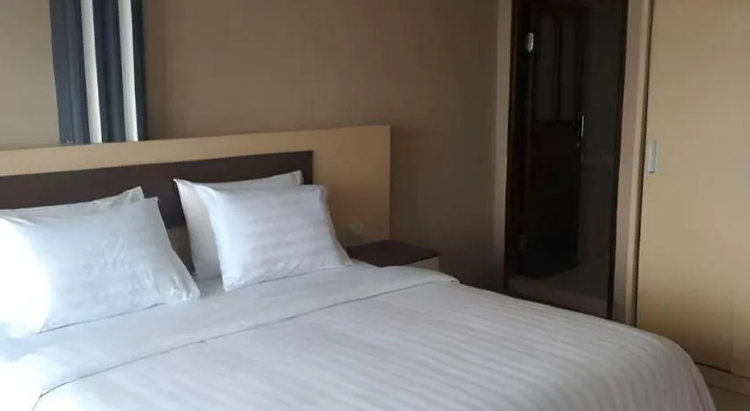 Bed in Samosir Cottages Resort