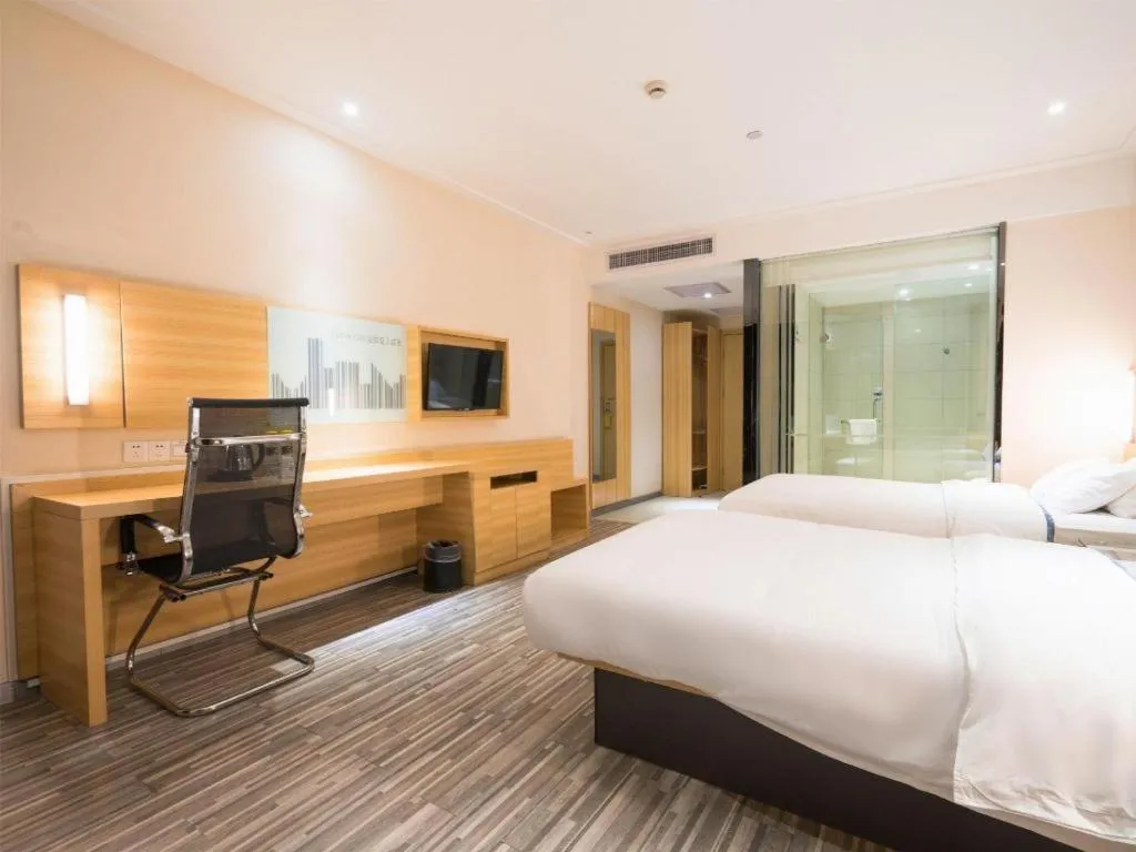 Bed in City Comfort Inn Wuhan High Speed Railway Station