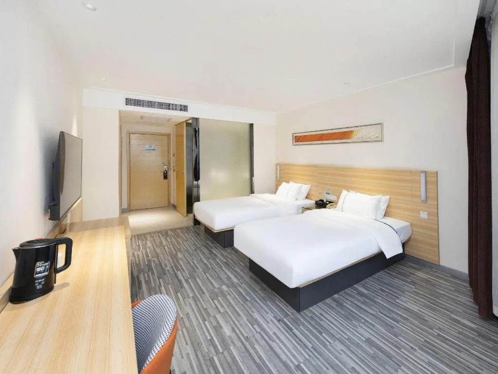 Bed in City Comfort Inn Wuhan High Speed Railway Station